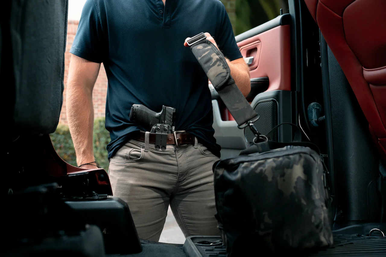 Walther PDP Holster AIWB standing by truck